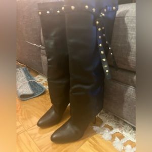 Valentino black boots with gold detail .